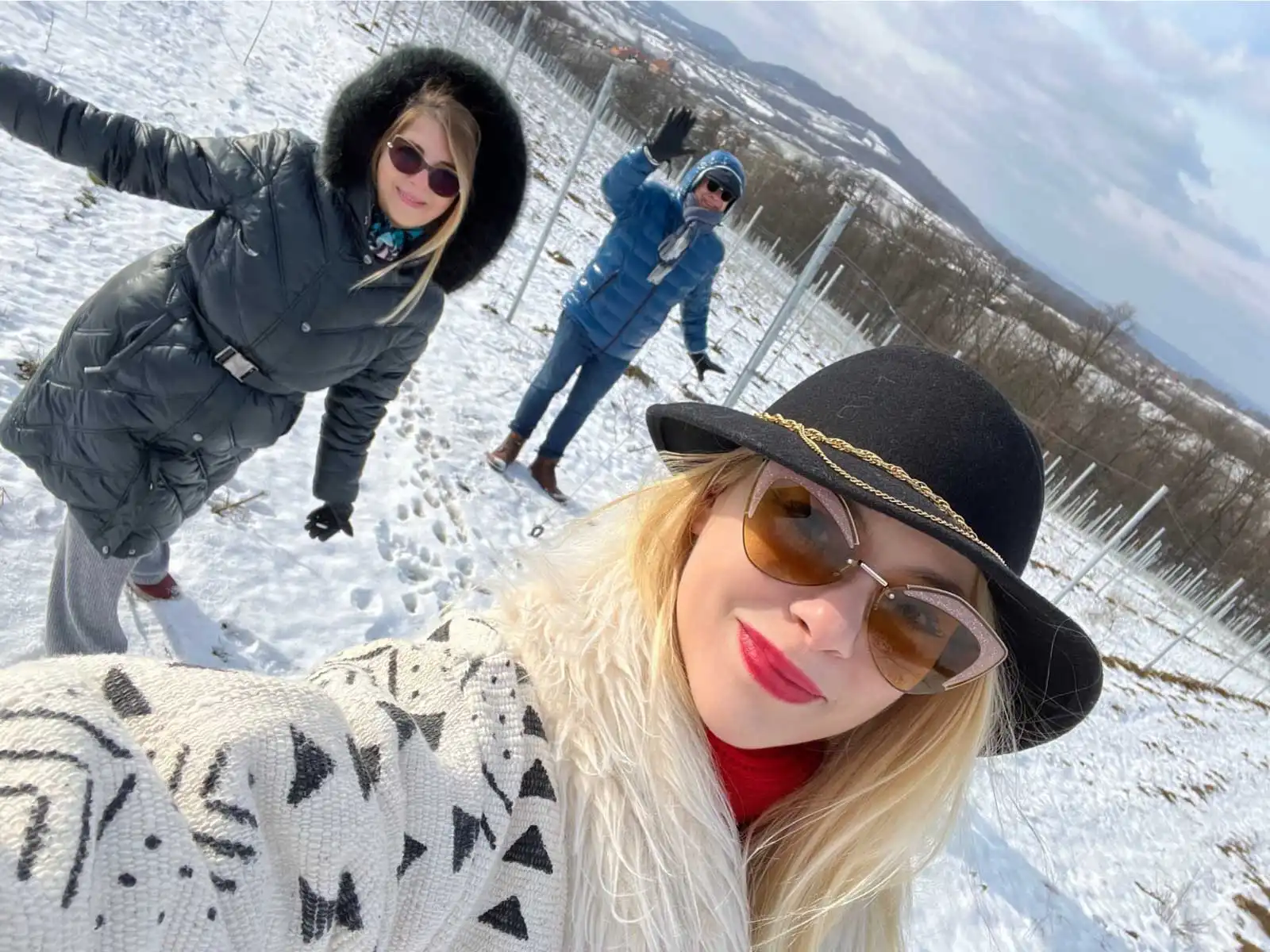 friends in the snowy vineyard