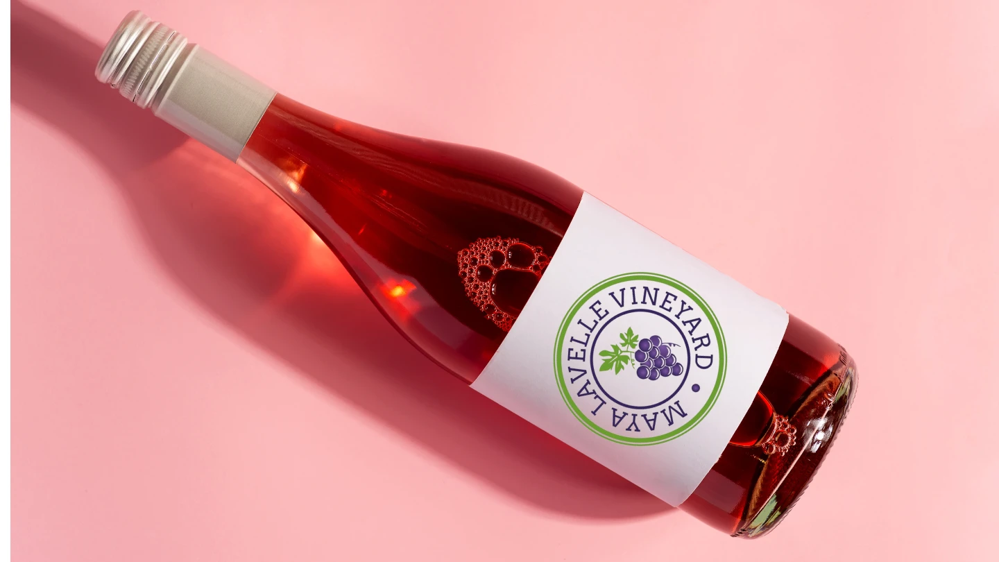 a bottle of rosé lying on a pink ground
